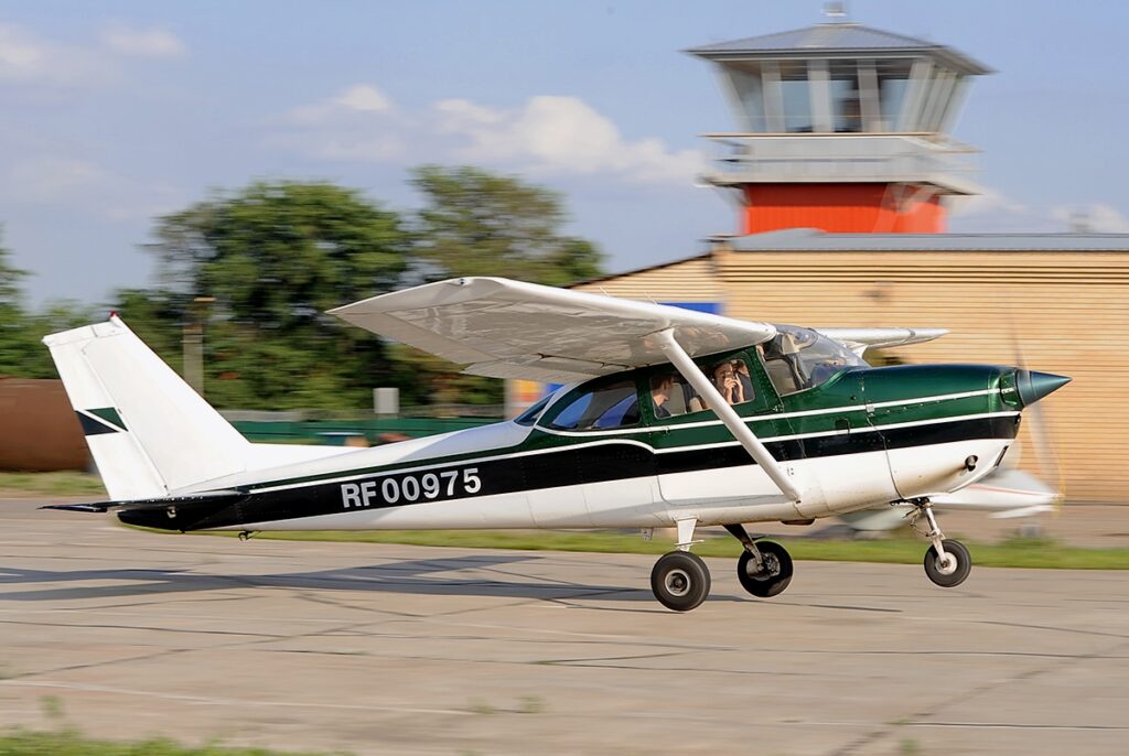 Cessna 182 on the runway at a small airfield