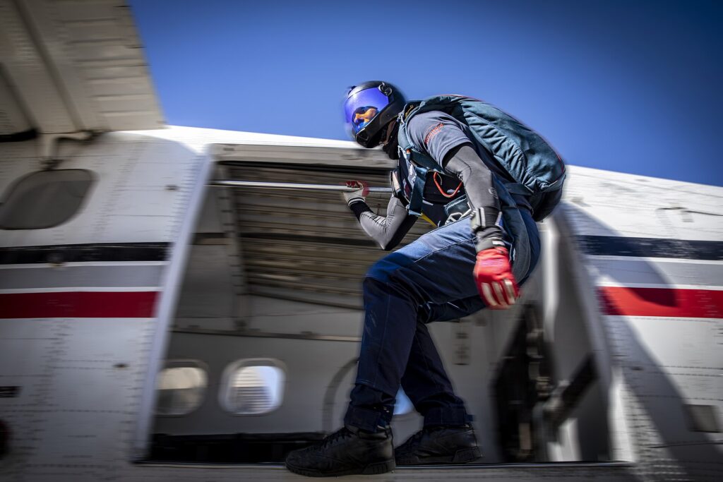 Skydiver exiting the aircraft door